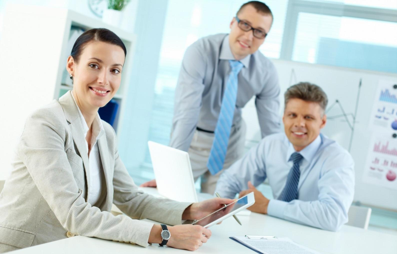 Students analyzing trading charts and discussing market patterns